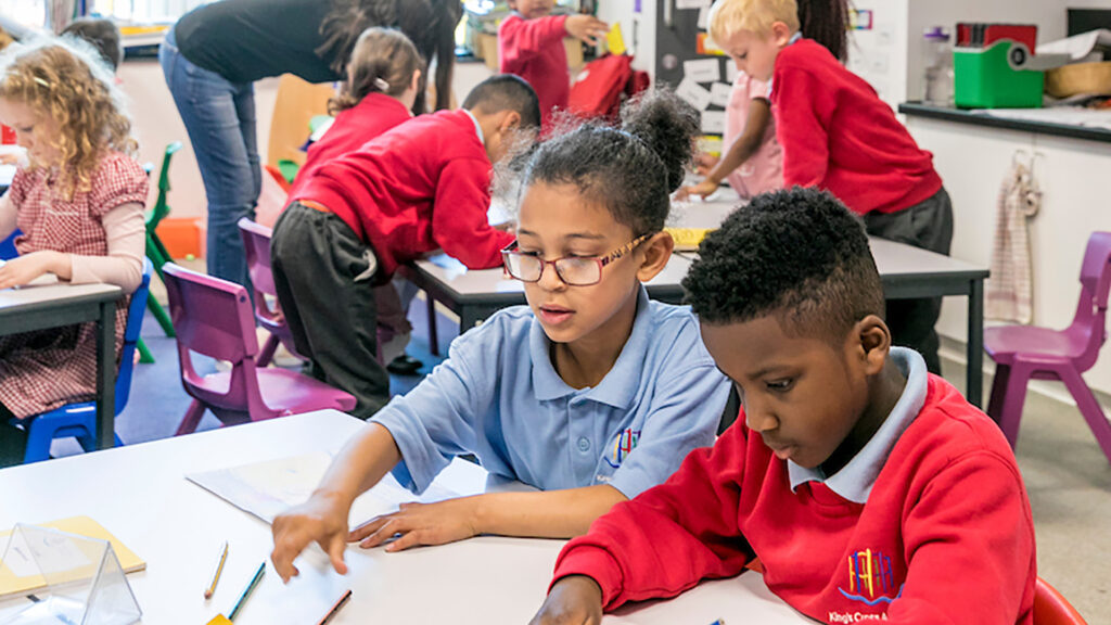 Children in classroom at King's Cross Academy Primary School